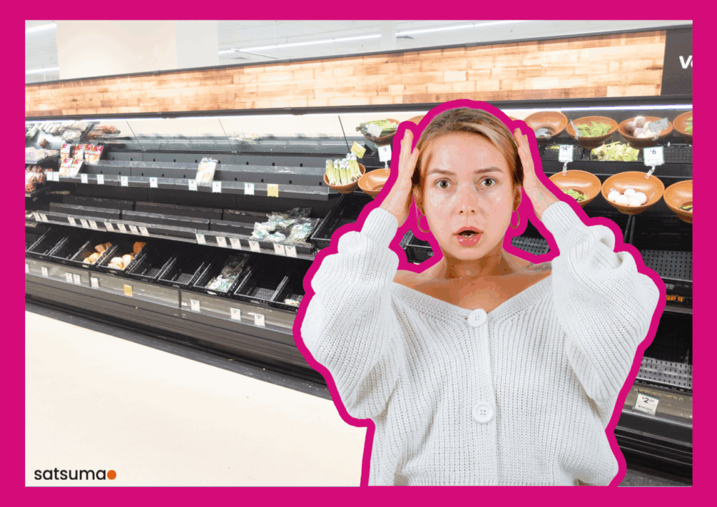 In a supermarket full of empty shelves, a woman looks horrified